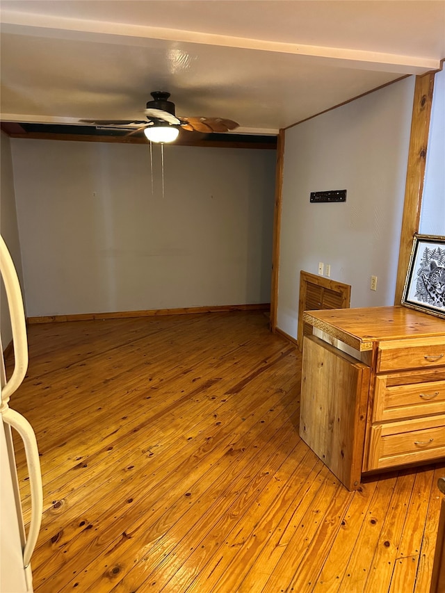 interior space featuring light wood-type flooring and ceiling fan