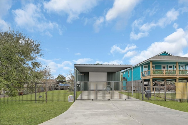 view of front of home with a front lawn and a carport