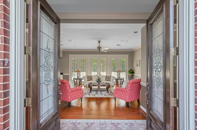 entryway featuring crown molding, ceiling fan, french doors, and light hardwood / wood-style floors