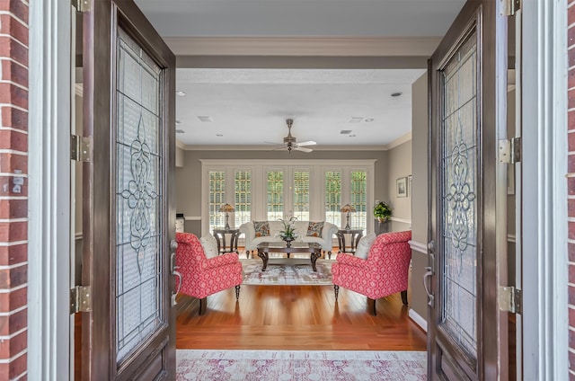 22222 Holly Creek Trl, Tomball, TX 77377 - foyer with wood finished floors, crown molding, a ceiling fan, and baseboards