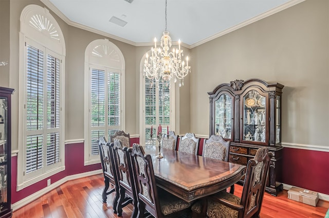 22222 Holly Creek Trl, Tomball, TX 77377 - dining area with a chandelier, hardwood / wood-style floors, baseboards, and ornamental molding