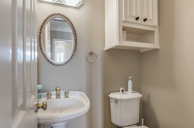 22222 Holly Creek Trl, Tomball, TX 77377 - half bathroom featuring a sink and toilet