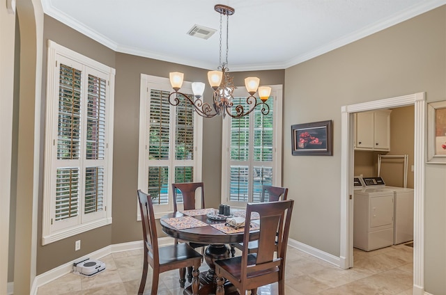 22222 Holly Creek Trl, Tomball, TX 77377 - dining space with washing machine and dryer, a chandelier, ornamental molding, light tile patterned flooring, and baseboards