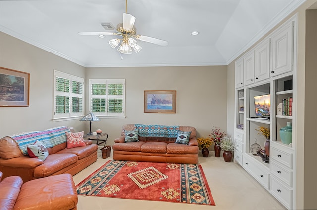 carpeted living room with ceiling fan and ornamental molding