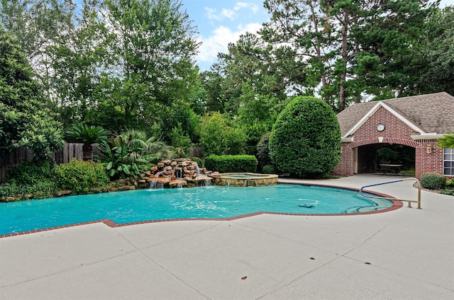 22222 Holly Creek Trl, Tomball, TX 77377 - view of pool featuring a patio area, a pool with connected hot tub, and view of wooded area