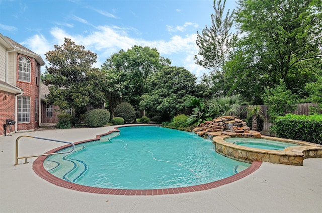 view of pool featuring an in ground hot tub and a patio area