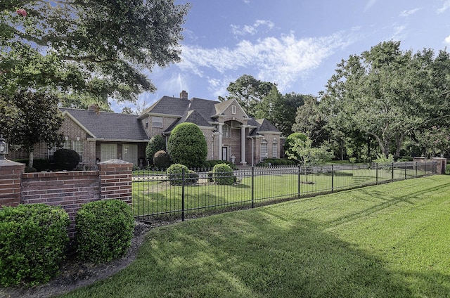 22222 Holly Creek Trl, Tomball, TX 77377 - view of front of property with brick siding and a chimney