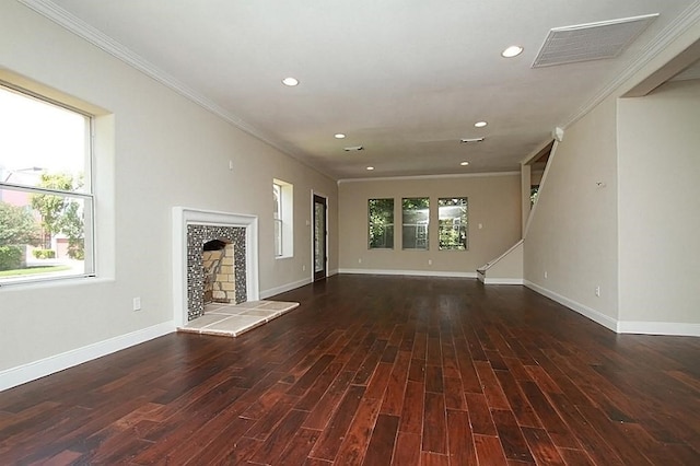unfurnished living room featuring baseboards, ornamental molding, visible vents, and recessed lighting