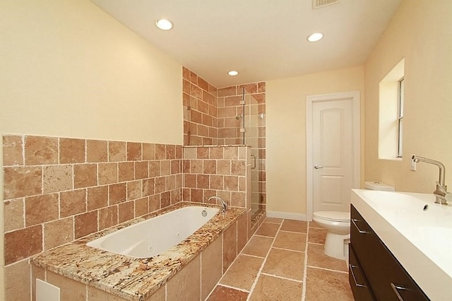 bathroom with a bath, toilet, recessed lighting, vanity, and a stall shower