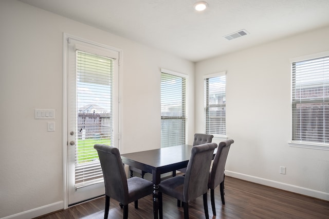 dining room featuring dark wood-type flooring