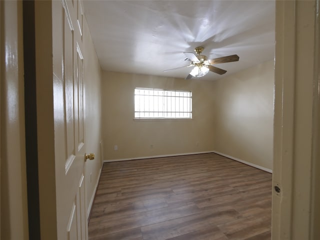 spare room featuring ceiling fan and hardwood / wood-style flooring