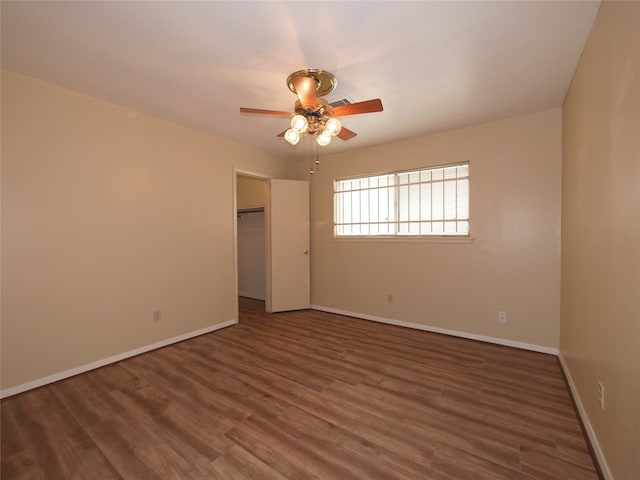 unfurnished room featuring ceiling fan and hardwood / wood-style flooring