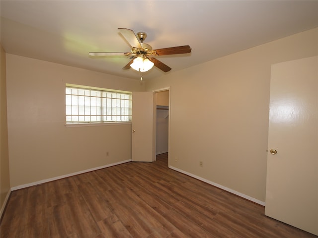 empty room featuring hardwood / wood-style floors and ceiling fan