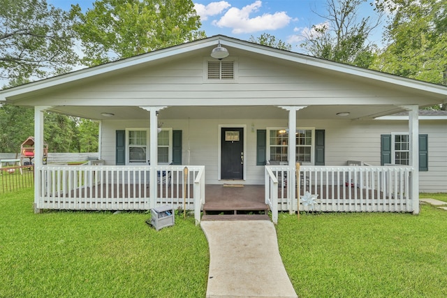 view of front facade featuring a front lawn and covered porch