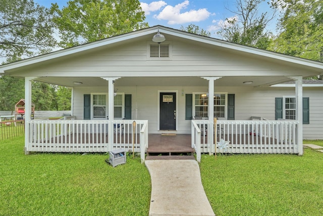 view of front of house with a porch and a front lawn