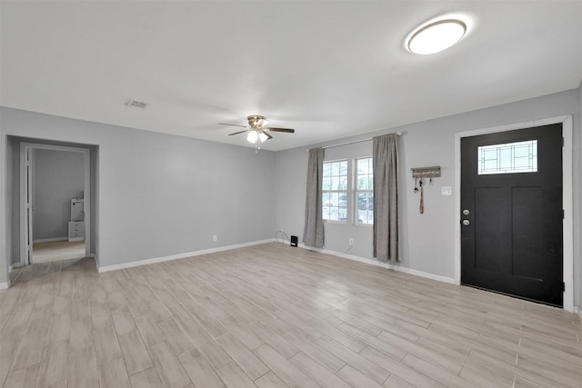 foyer with light hardwood / wood-style floors and ceiling fan