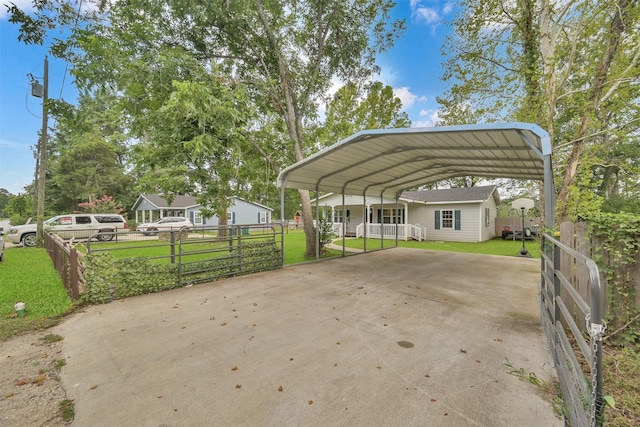 view of car parking with a carport and a yard