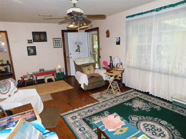 living room with ceiling fan and wood-type flooring