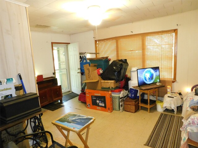 interior space with tile patterned flooring and ceiling fan