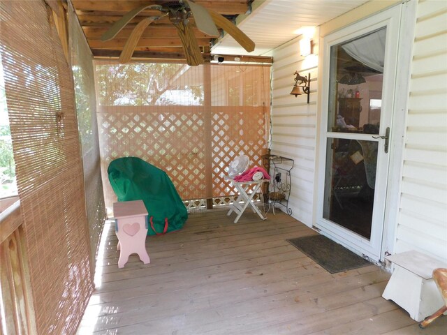 view of patio / terrace featuring ceiling fan and a wooden deck