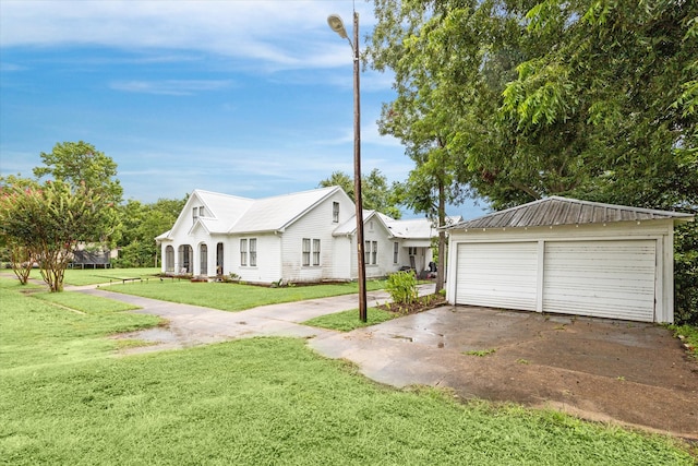 exterior space featuring a garage and a lawn