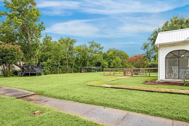 view of yard featuring a trampoline