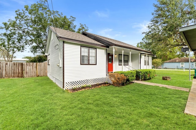 single story home featuring a front yard and covered porch