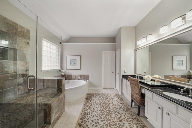 bathroom featuring lofted ceiling, vanity, independent shower and bath, and tile patterned flooring