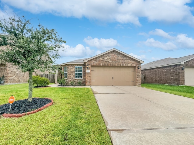 ranch-style home with a garage and a front lawn