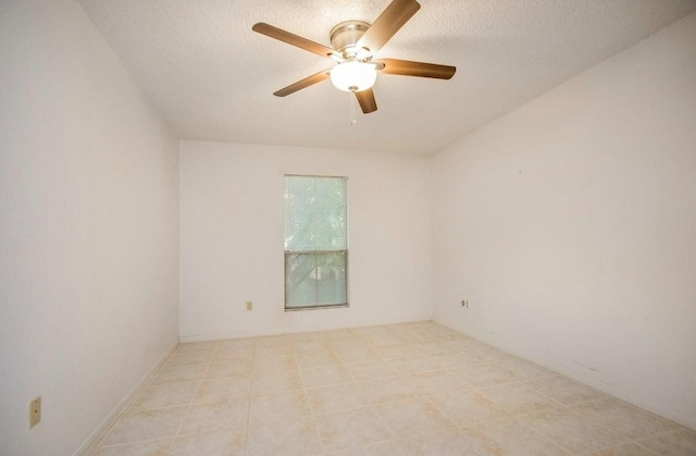 spare room featuring a textured ceiling and ceiling fan