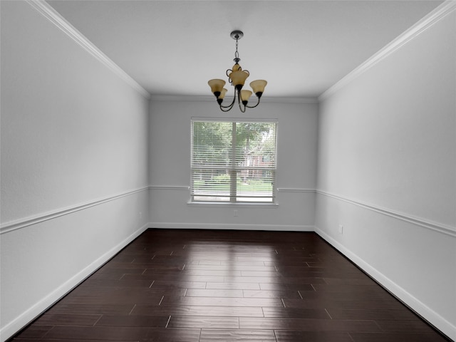 empty room featuring ornamental molding, an inviting chandelier, and hardwood / wood-style floors