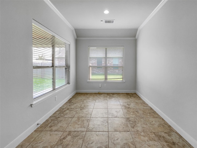 unfurnished room with light tile patterned flooring and crown molding