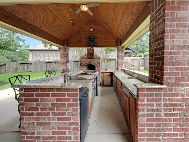 view of patio / terrace with area for grilling, sink, a gazebo, and ceiling fan