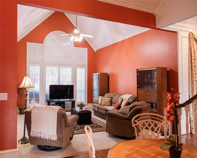 living room with wood-type flooring, vaulted ceiling, ornamental molding, and ceiling fan