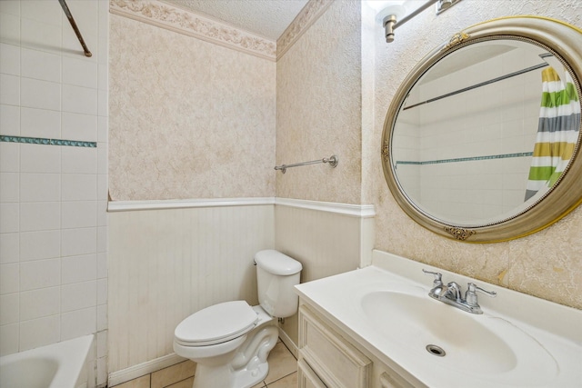 full bathroom with tile patterned floors, toilet, shower / tub combo, a textured ceiling, and vanity