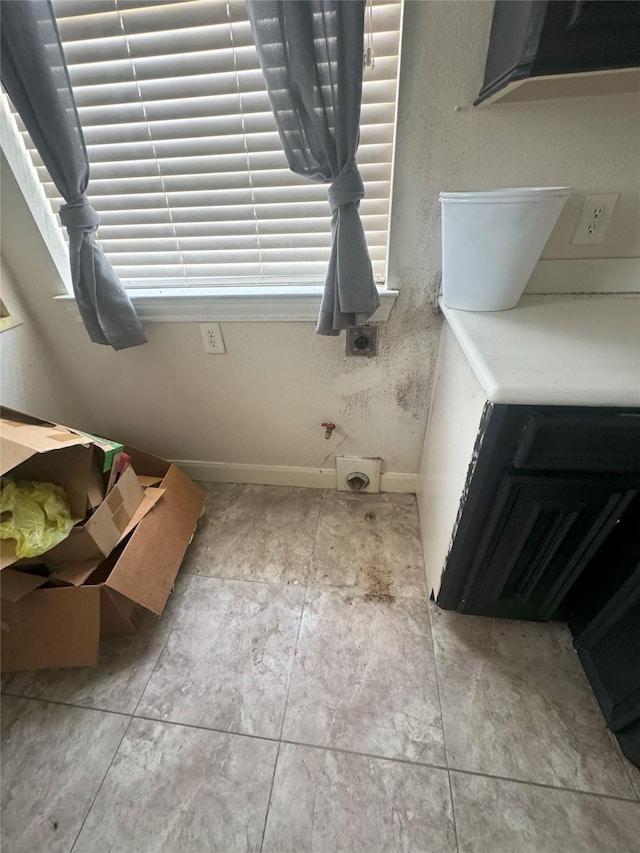 bathroom with tile patterned floors