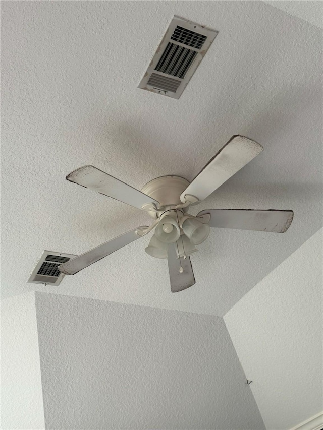 interior details featuring ceiling fan