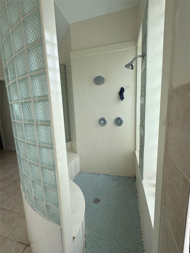 bathroom with walk in shower and tile patterned floors