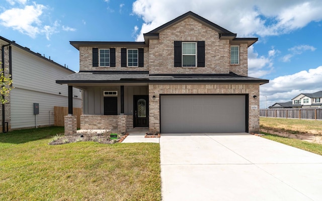 view of front of house with a garage and a front yard