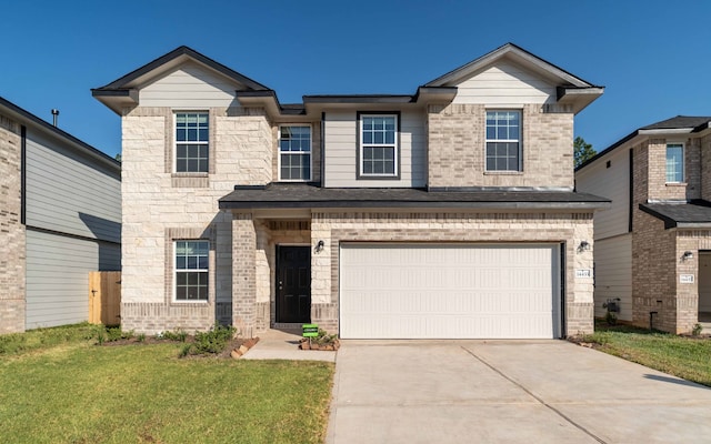 view of front facade featuring a front yard and a garage