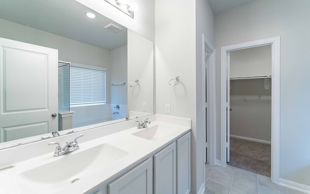 bathroom with tile patterned flooring and vanity