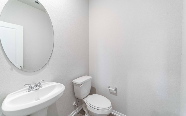 bathroom with sink and toilet