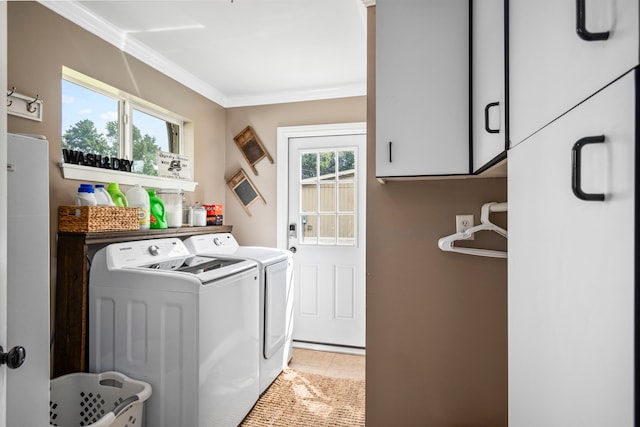 clothes washing area with cabinets, ornamental molding, independent washer and dryer, and light tile patterned floors