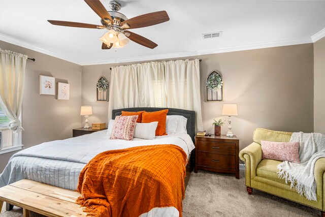 bedroom with ceiling fan, light carpet, and ornamental molding