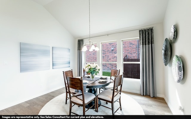 dining area with a chandelier, light hardwood / wood-style flooring, and vaulted ceiling