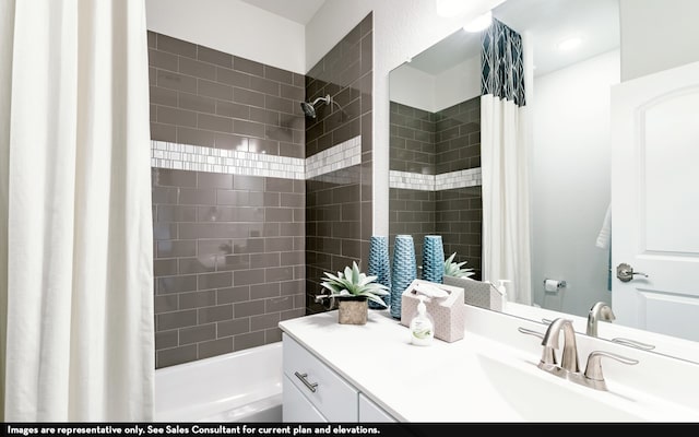 bathroom featuring shower / bath combo with shower curtain and vanity