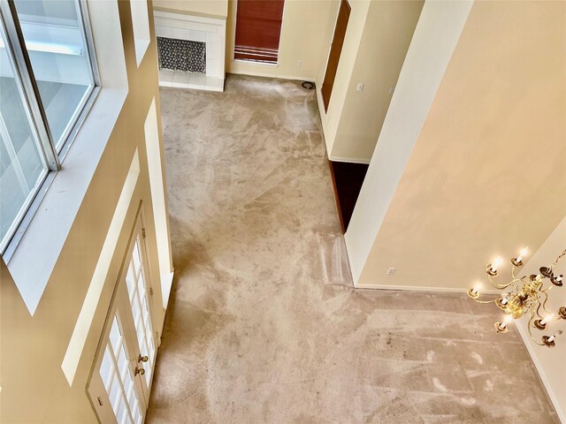 interior space featuring carpet floors and baseboards