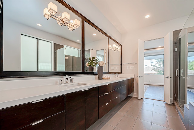 bathroom with vanity, tile patterned floors, and a shower with shower door