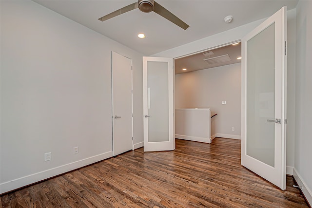 unfurnished bedroom featuring dark hardwood / wood-style flooring, french doors, and ceiling fan