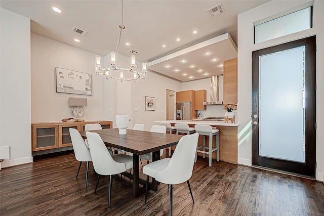 dining room with dark hardwood / wood-style floors